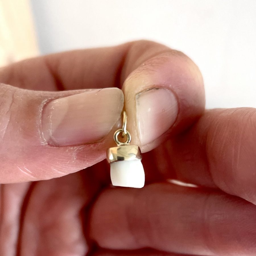 Colgante con diente de leche