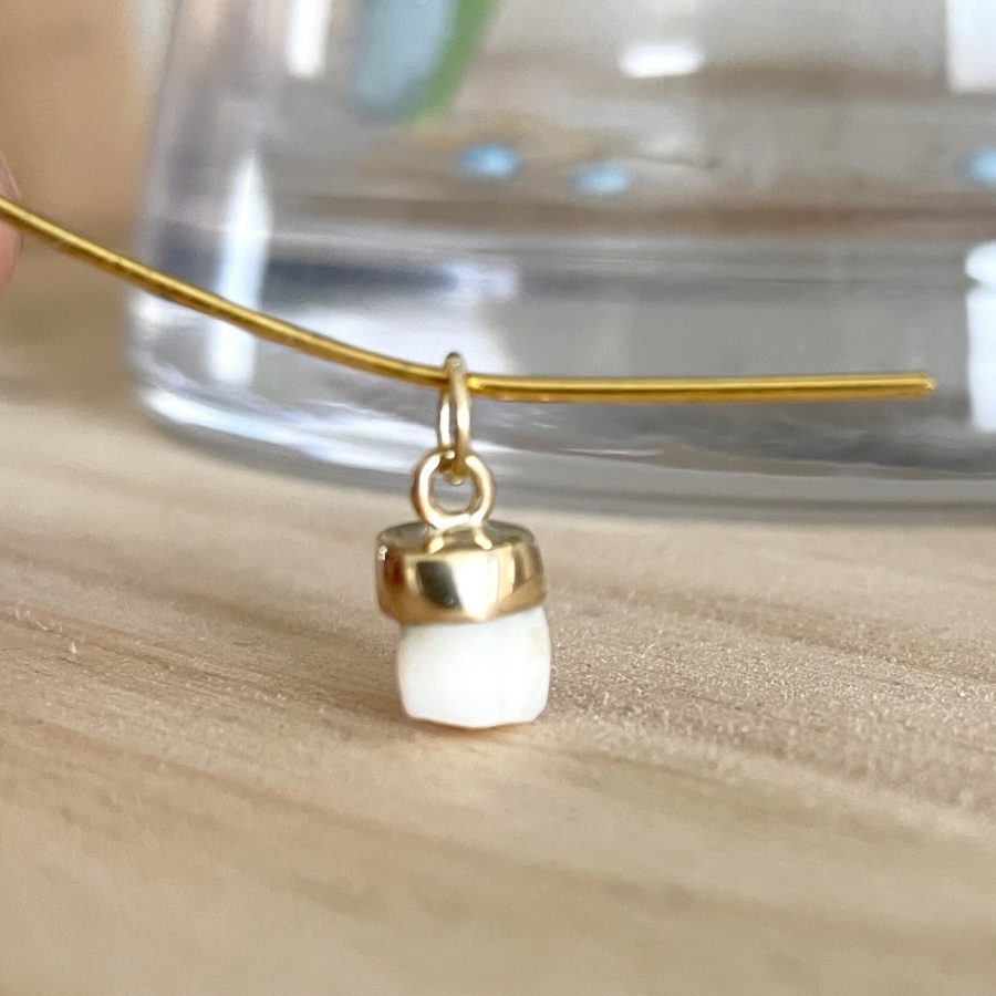 Colgante con diente de leche